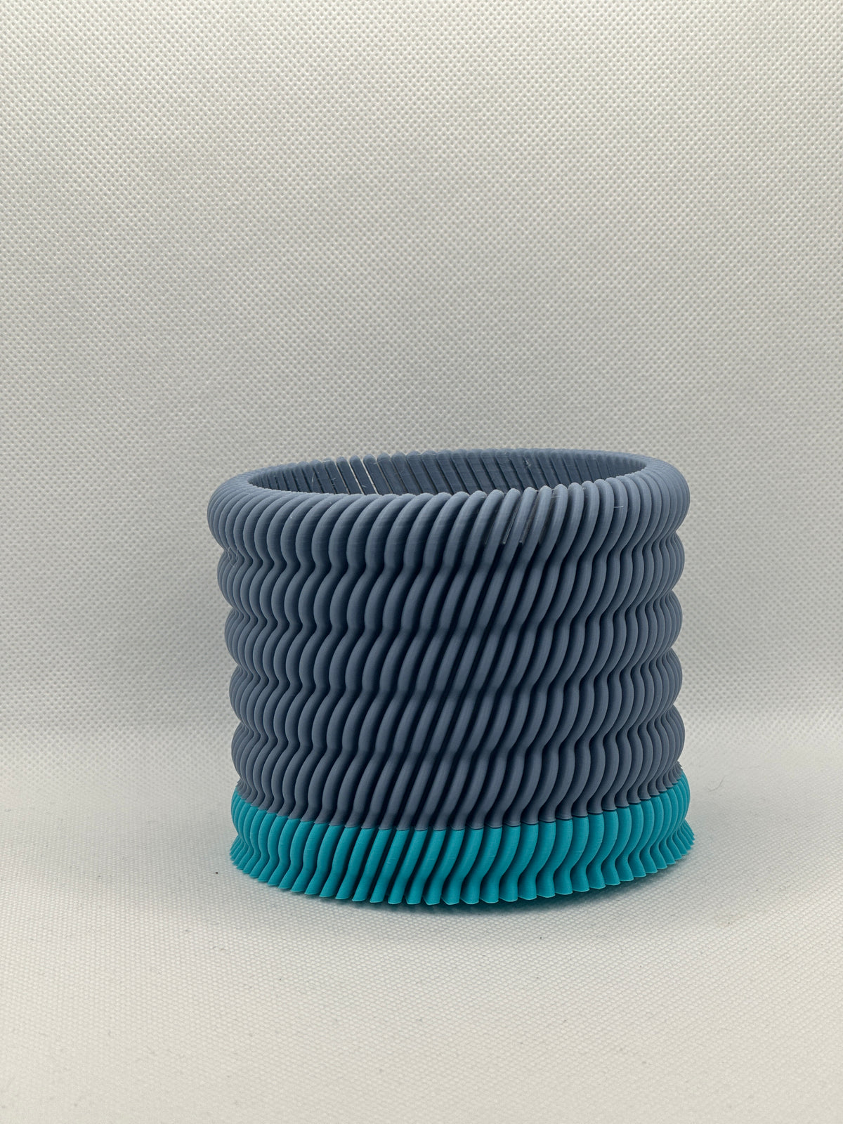 Modern Ripple Planter grey with teal base real product photo