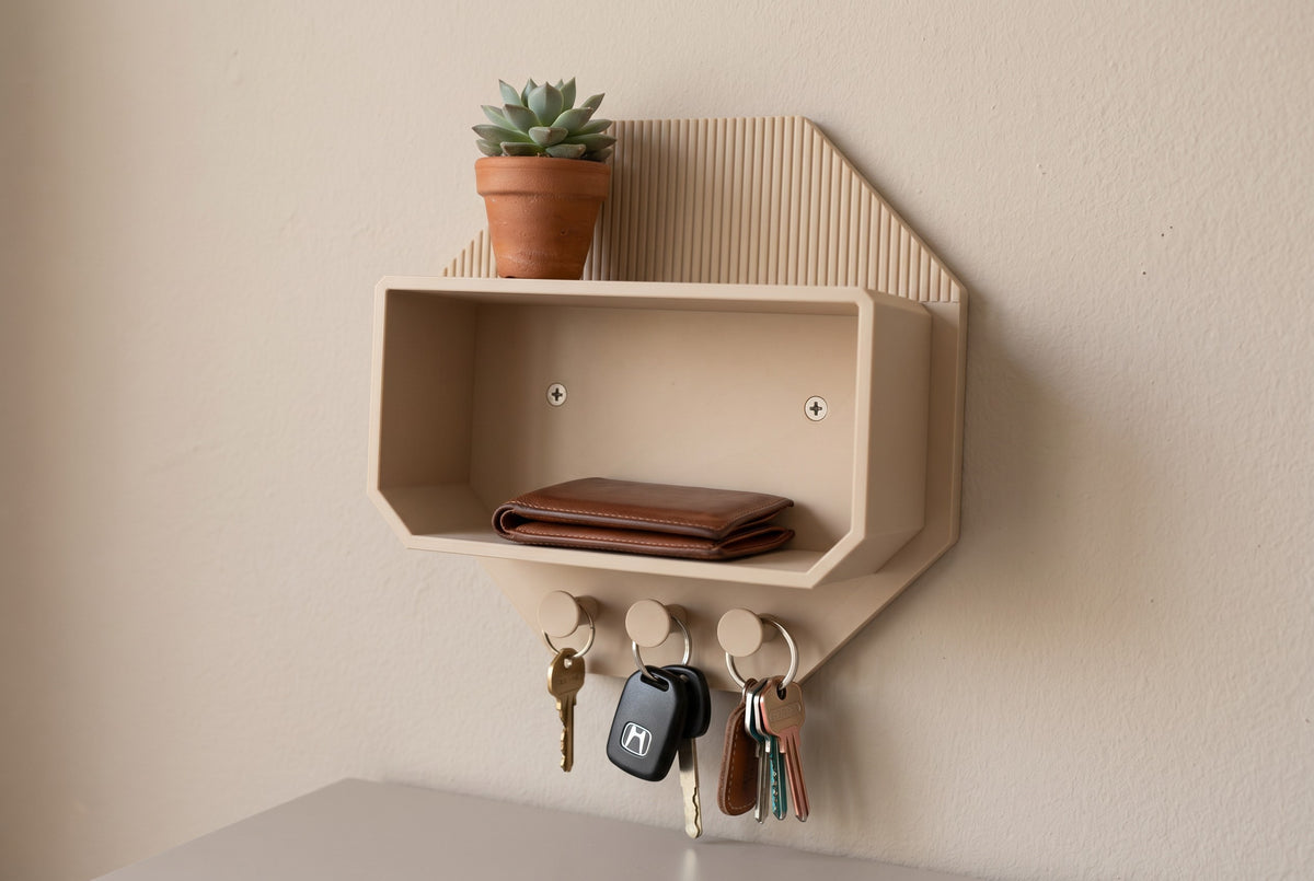 Octagonal beige wall shelf above a wooden sideboard with a plant and a wallet