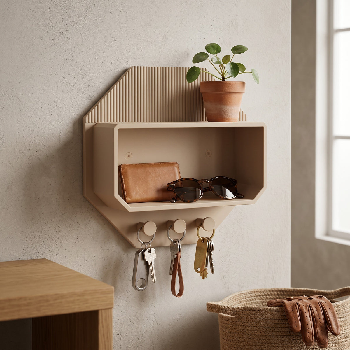 Octagonal beige wall shelf with a succulent and sunglasses beside a doorway