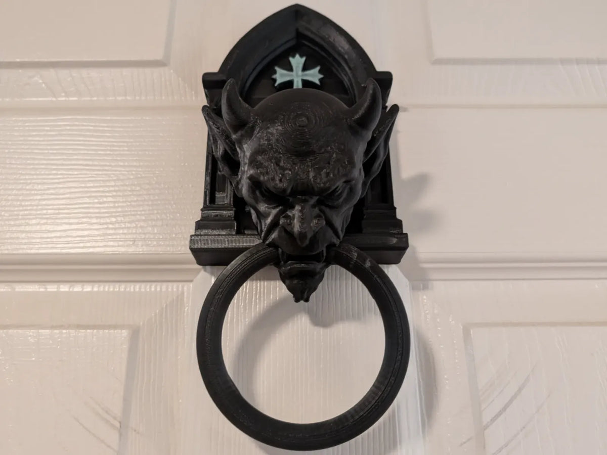 Gargoyle door knocker on cream door