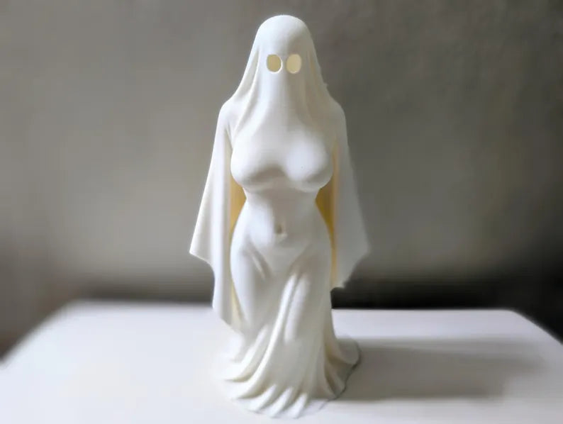 White Ghost Lady figurine against a dark backdrop
