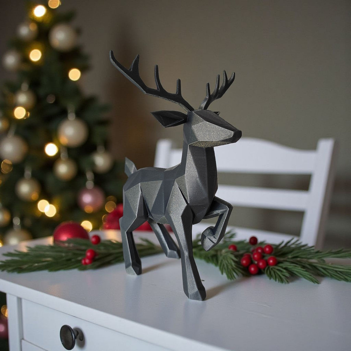Low poly reindeer with red and silver baubles and fairy lights