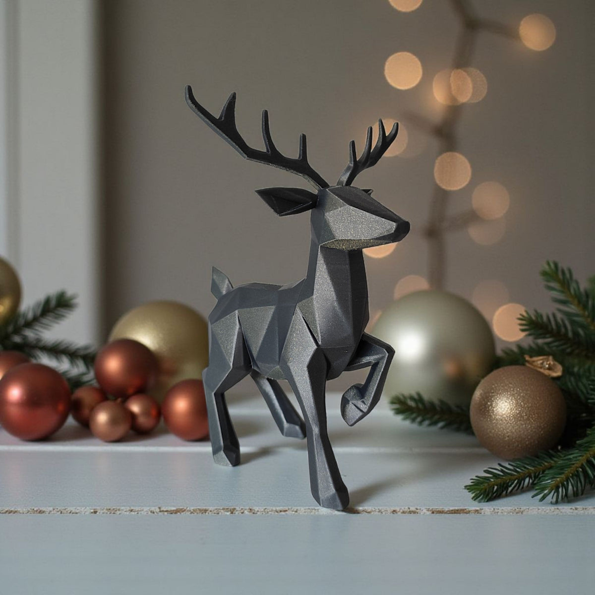Low poly reindeer on snowy windowsill with pine branches and baubles