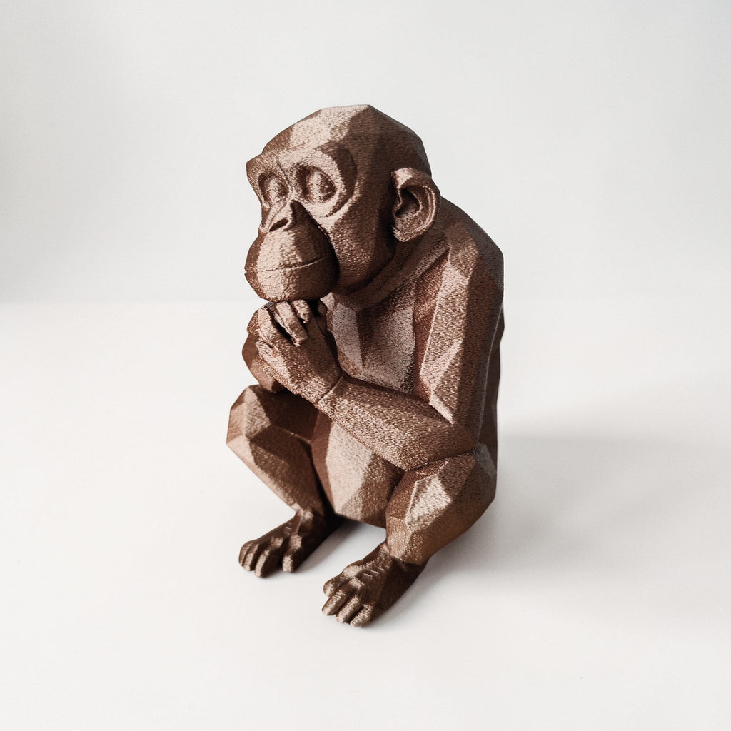 Thoughtful Low-Poly Chimpanzee Sculpture