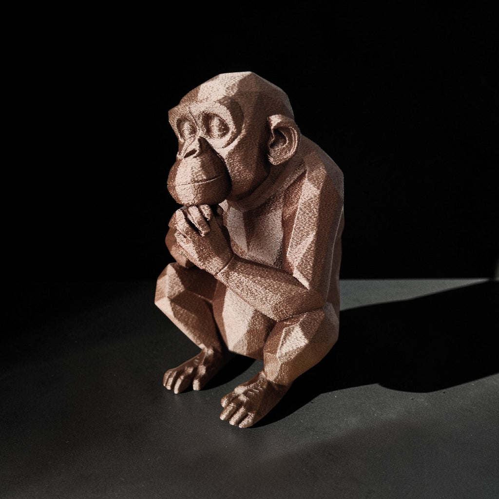 Thoughtful Low-Poly Chimpanzee Sculpture