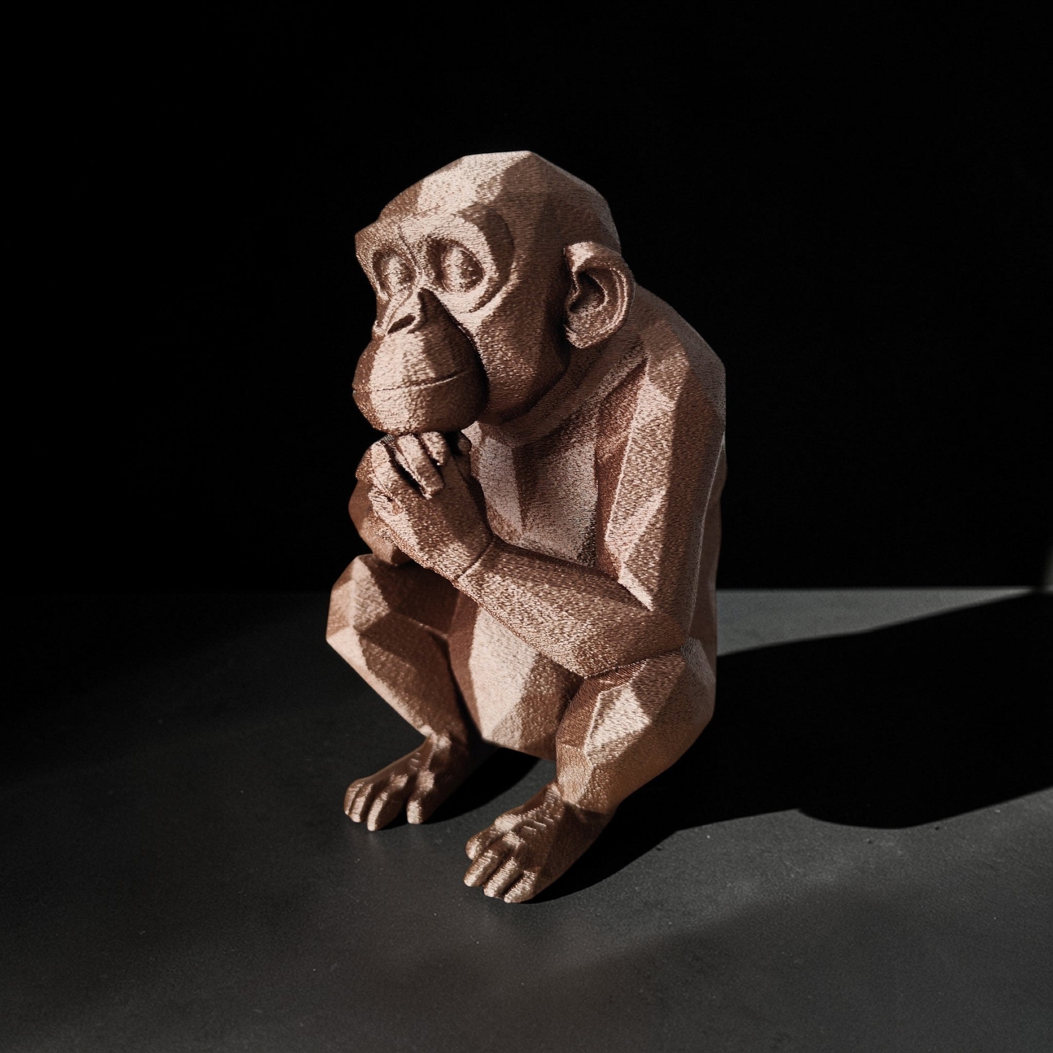 Thoughtful Low-Poly Chimpanzee Sculpture