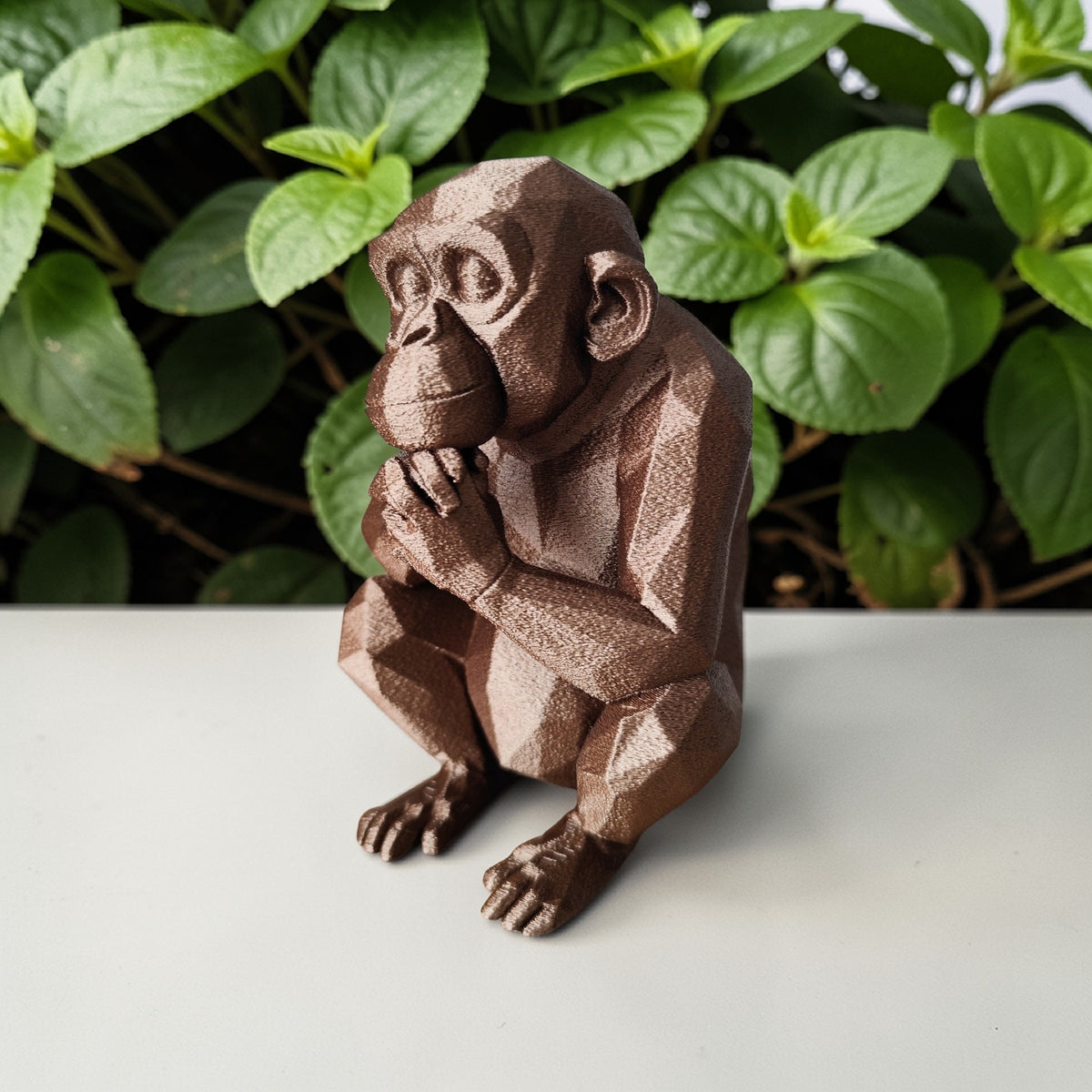 Thoughtful Low-Poly Chimpanzee Sculpture