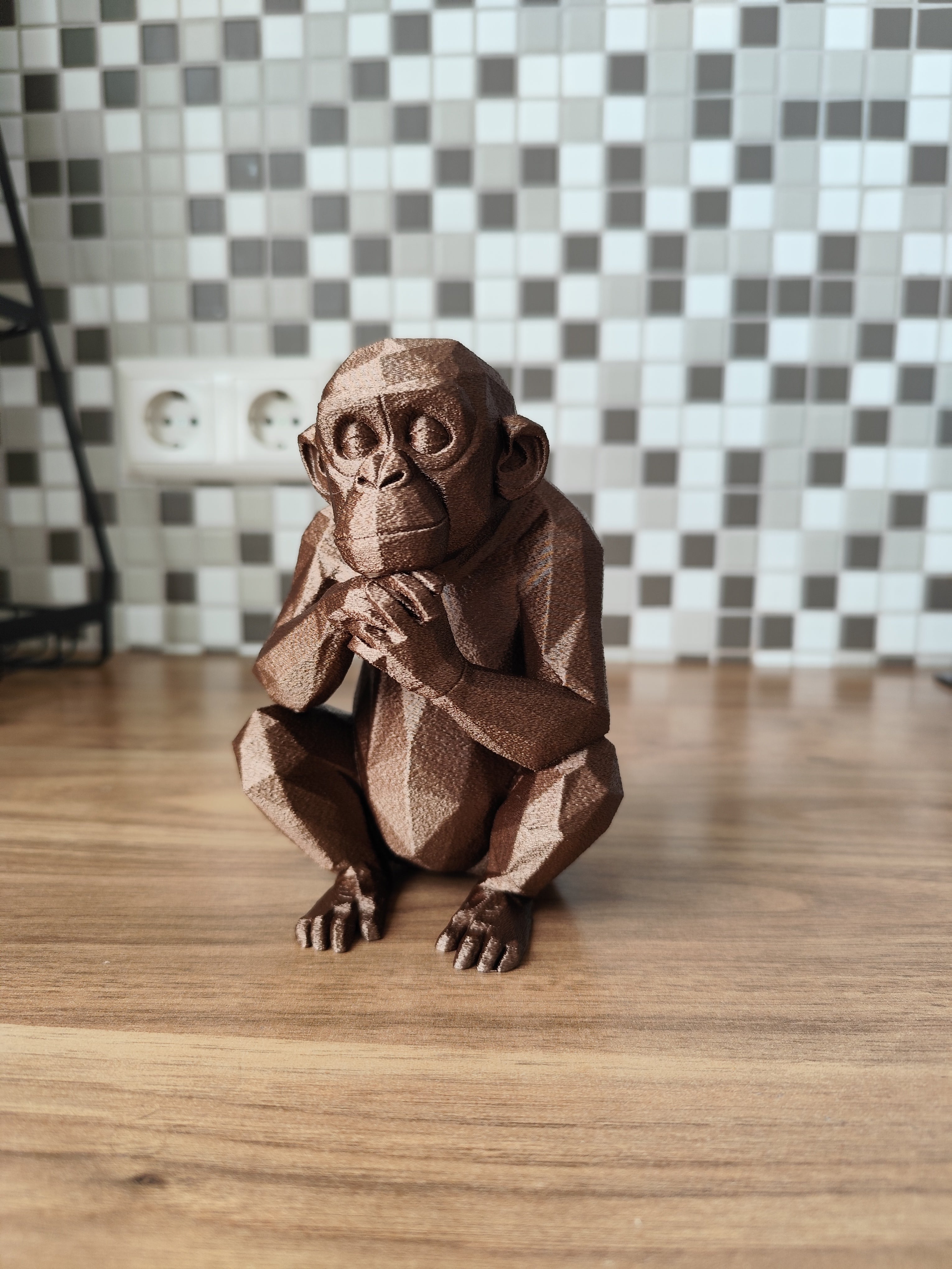 Thoughtful Low-Poly Chimpanzee Sculpture
