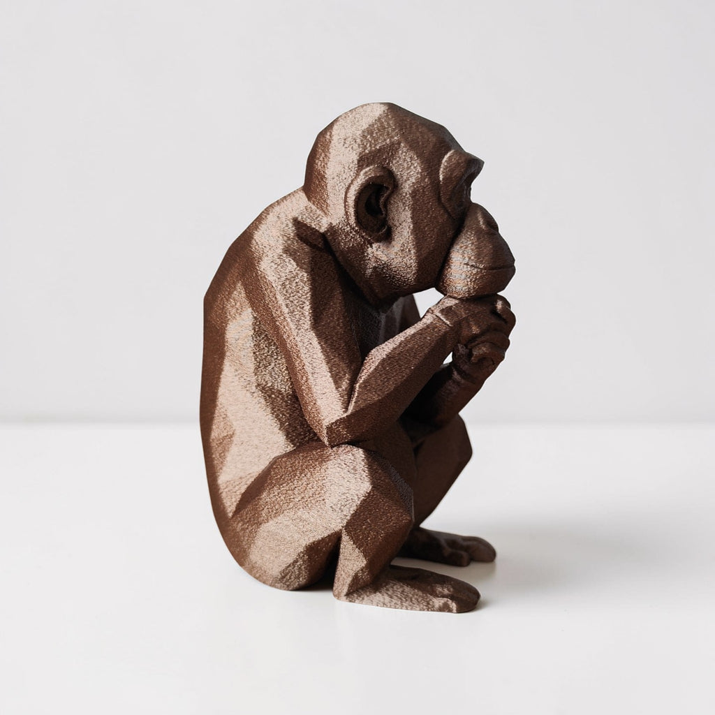 Thoughtful Low-Poly Chimpanzee Sculpture