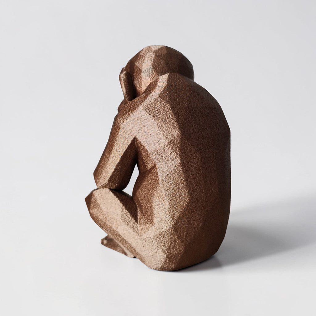 Thoughtful Low-Poly Chimpanzee Sculpture