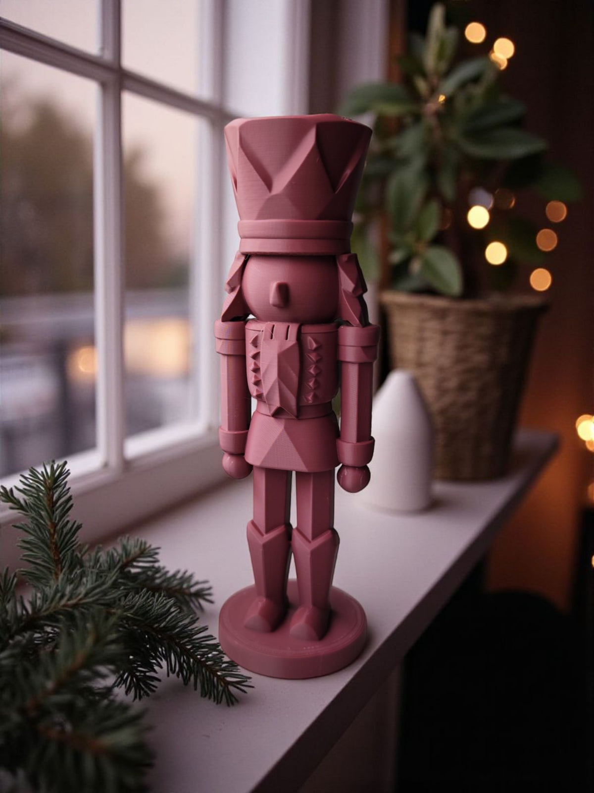 Burgundy nutcracker on white kitchen table product shot