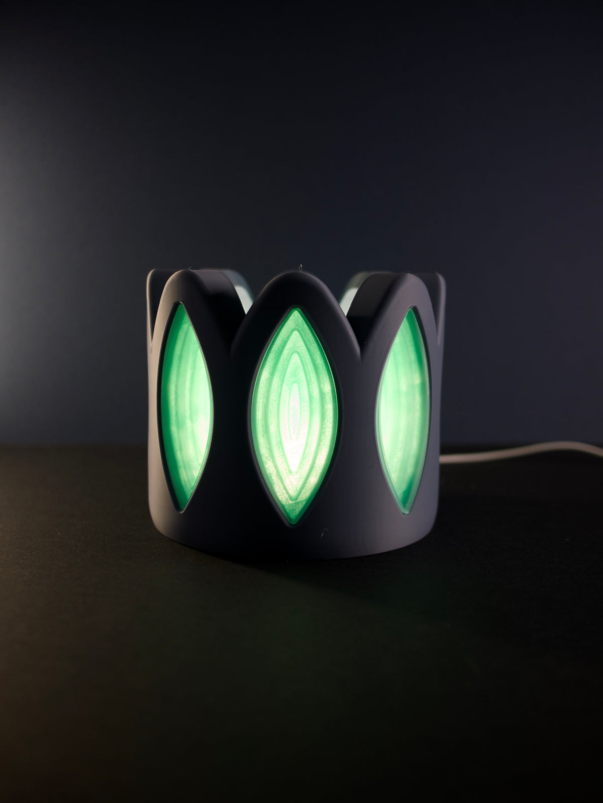 Whimsical Window Desktop Lamp product on dark surface showing full lamp profile cable visible