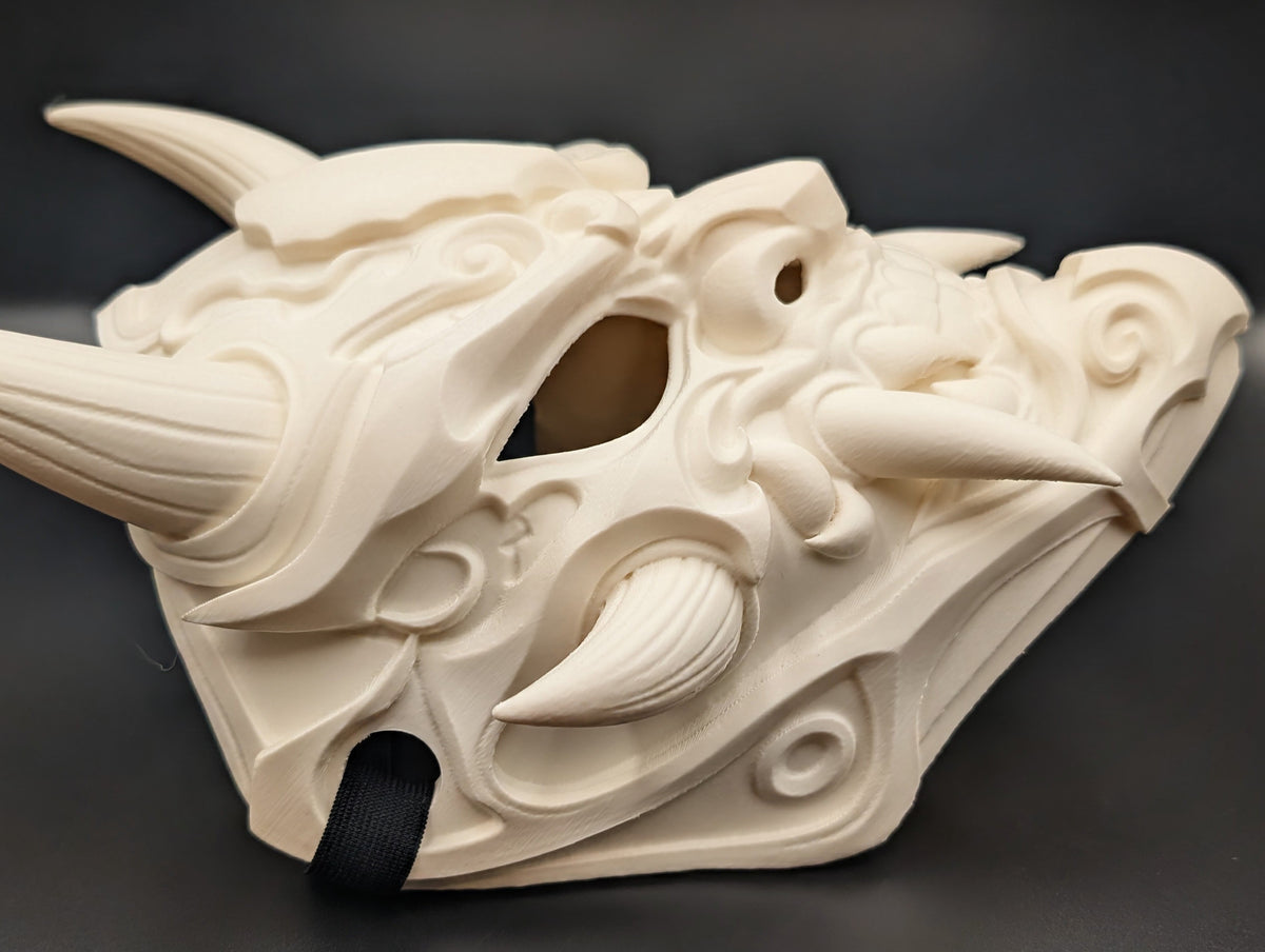 Side view showing the mask profile and strap slot. The strap pictured is not included.