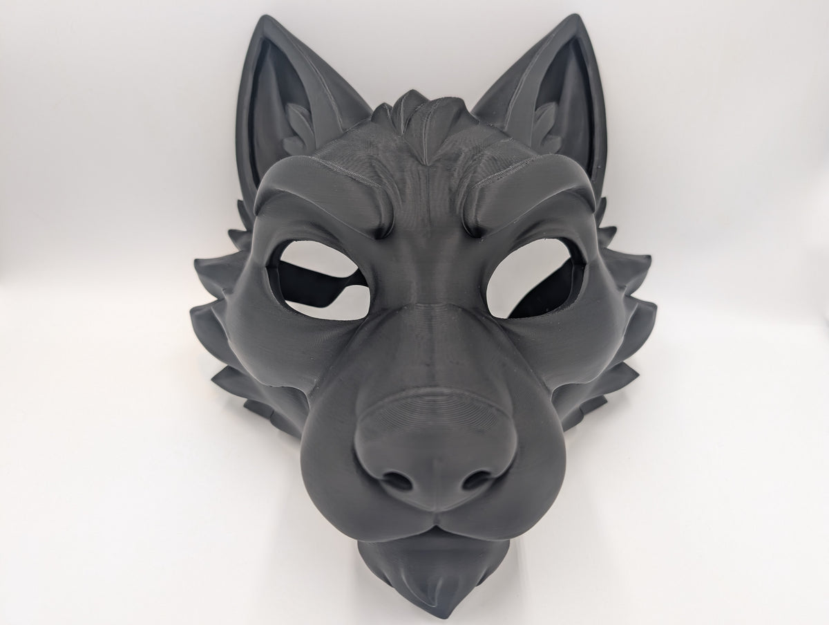 Side profile showing the Dire Wolf mask's pointed ear and sculpted muzzle without a strap