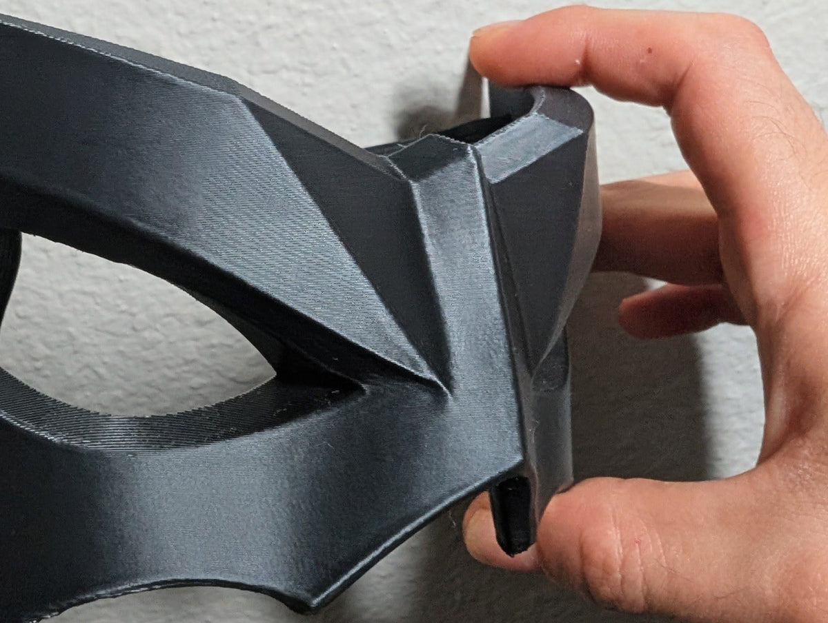 Close-up detail of the angular Shadow Sentinel upper-face mask; strap not included