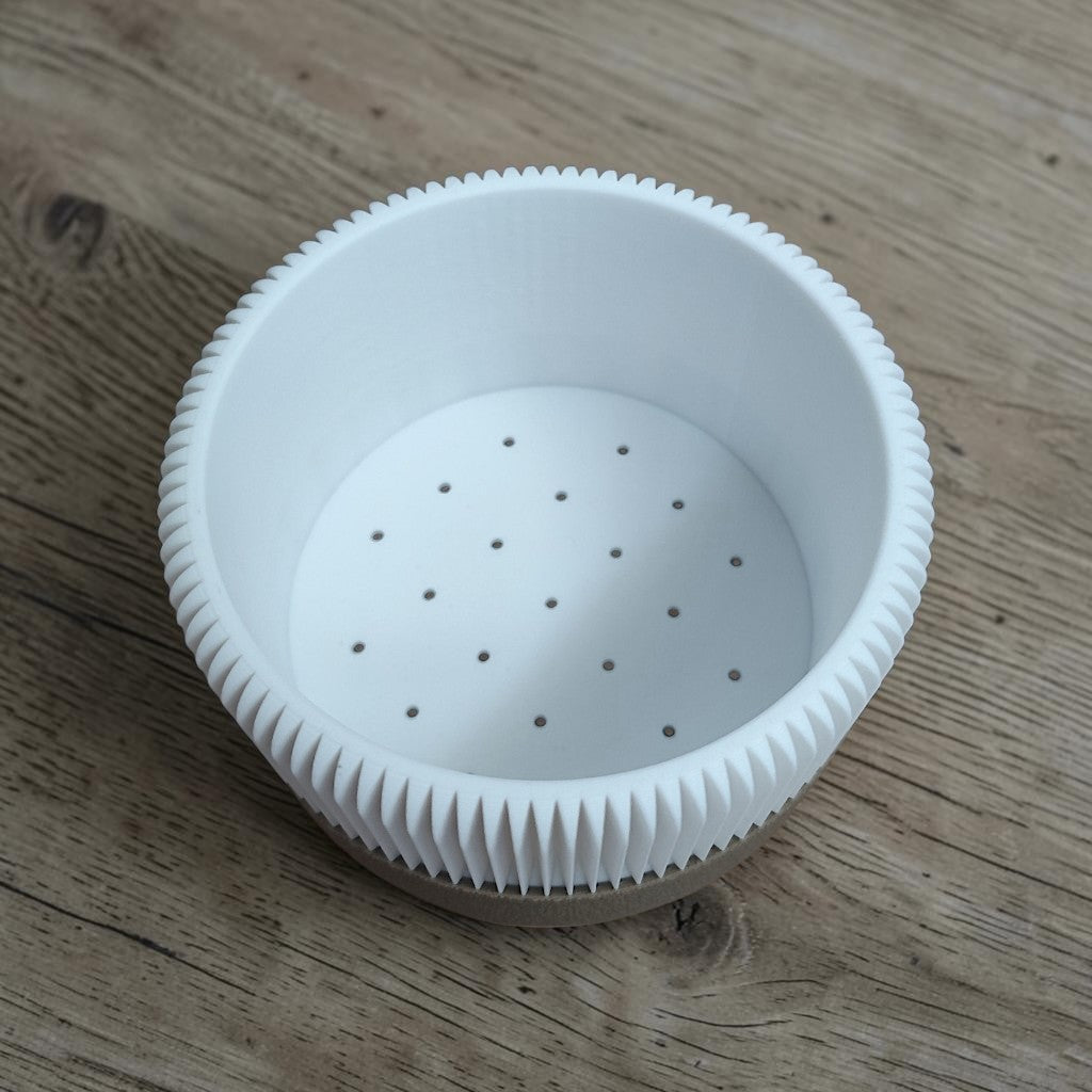 Top view of the ribbed planter body showing drainage holes inside