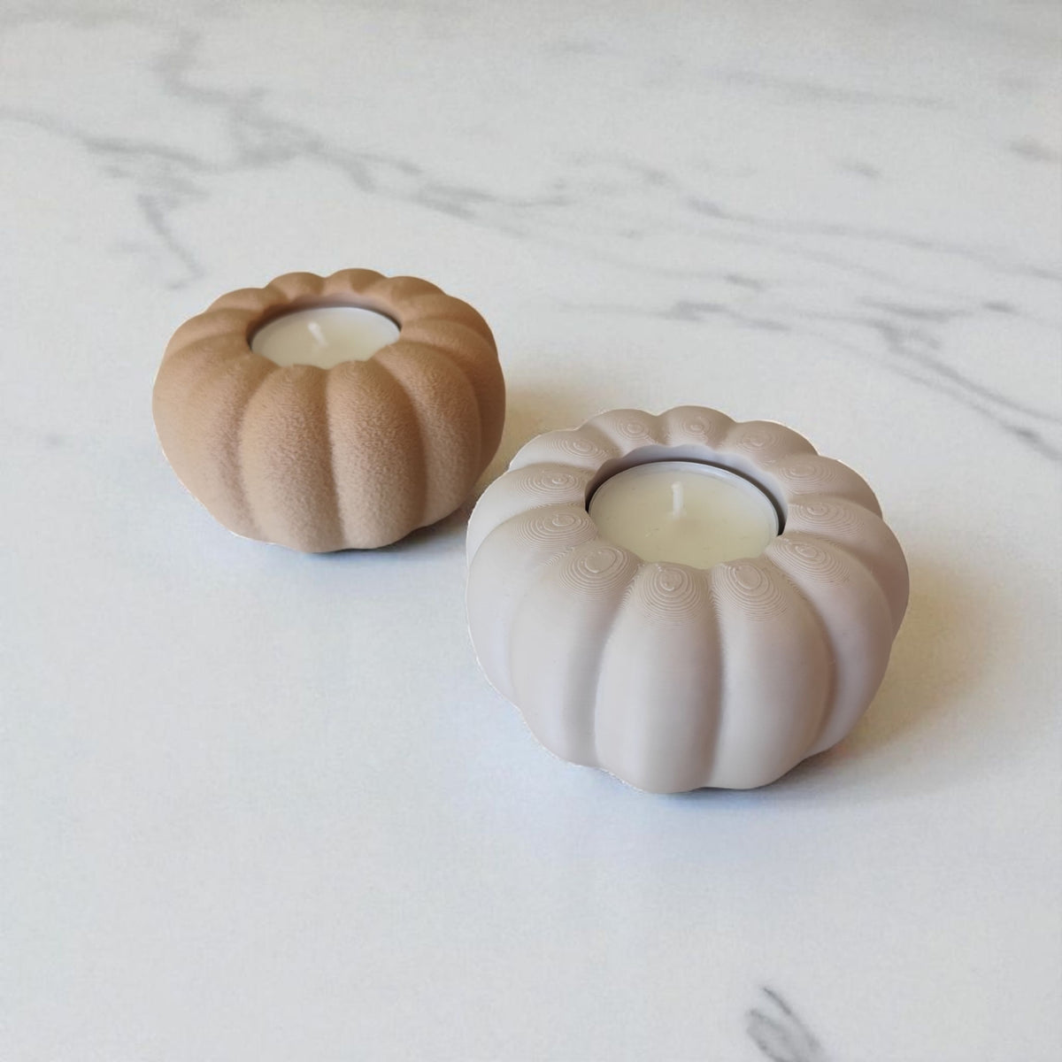 Two autumn pumpkin tealight holders beige and white on rustic wood planks lifestyle
