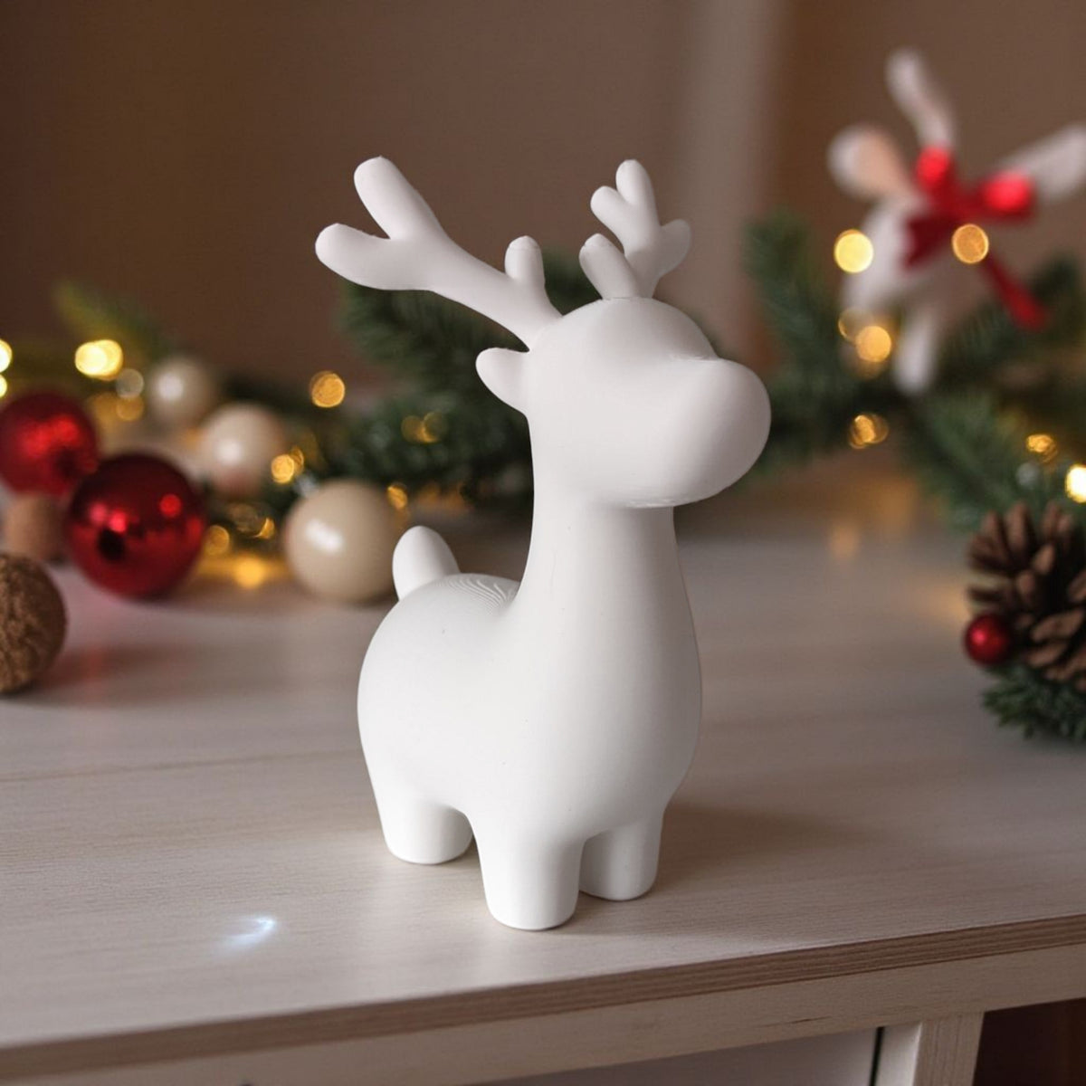 White and grey cute minimalist reindeer pair on wooden table with fairy lights and pine cones