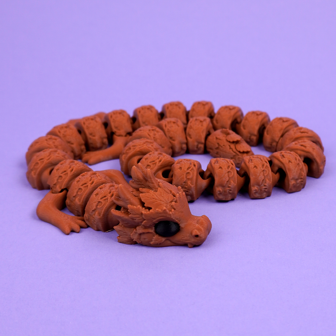 Articulated autumn dragon with textured linked body
