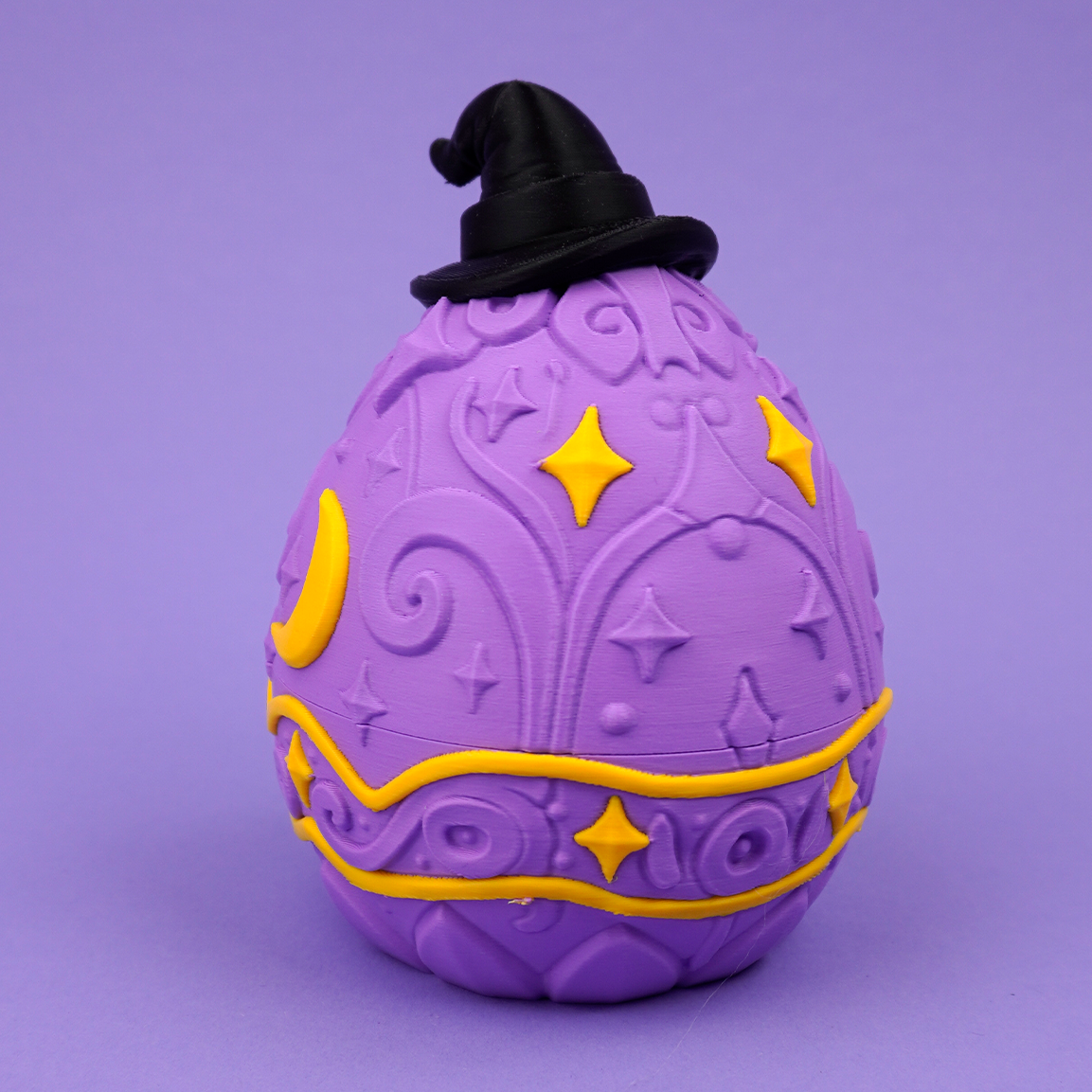 Closed purple Wizard Dragon Egg twist-lock box with black wizard hat
