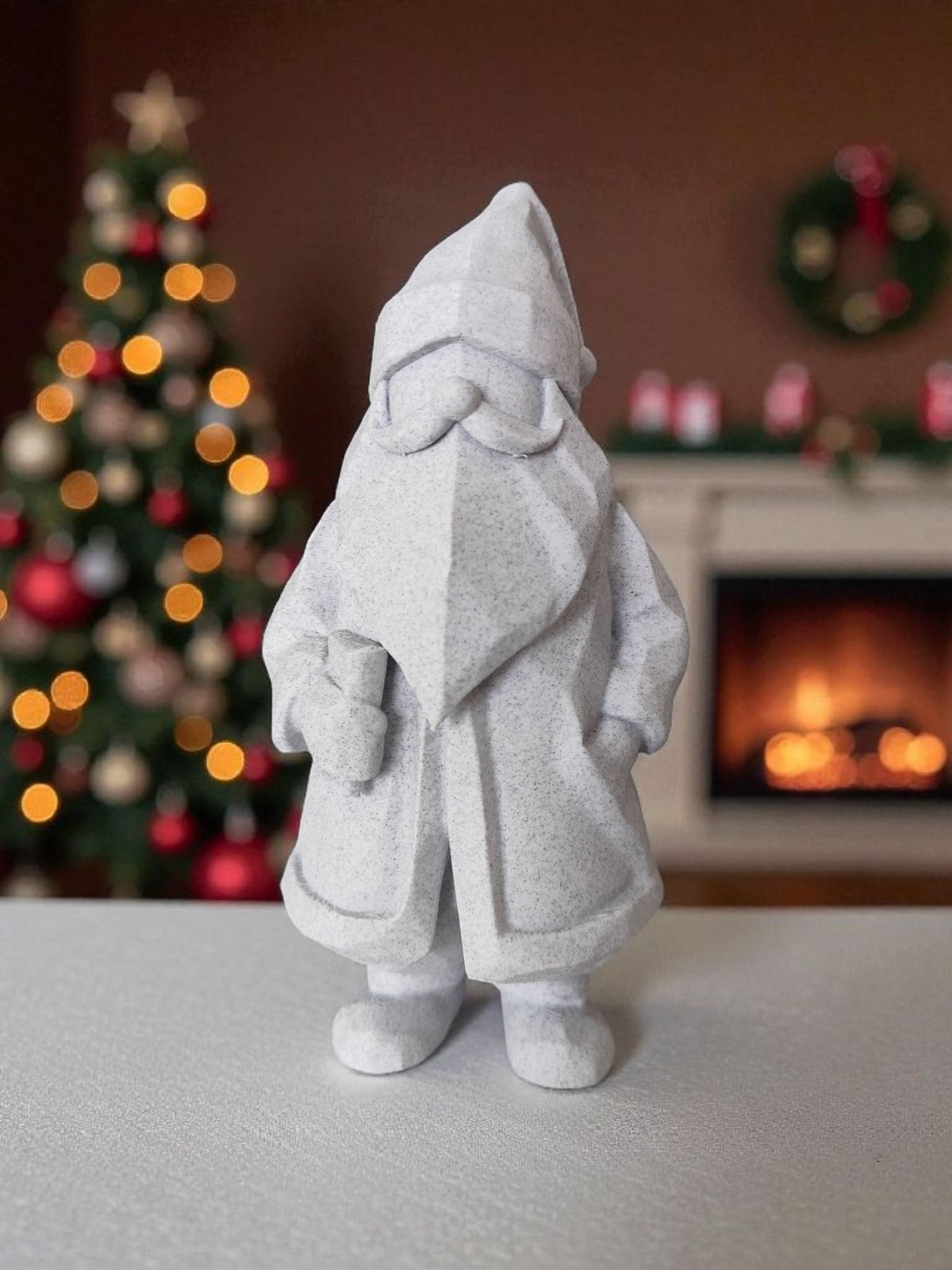 Minimalist low-poly white Santa Claus sculpture front view with Christmas tree bokeh background