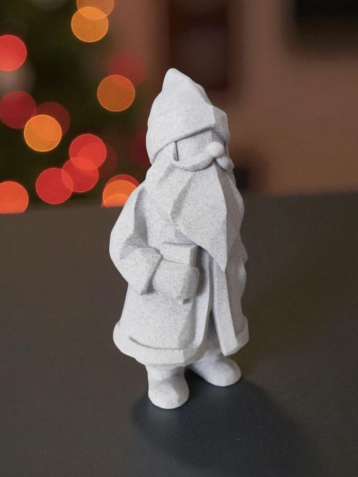 Minimalist Santa Claus figure back view on wooden log with roaring fireplace behind
