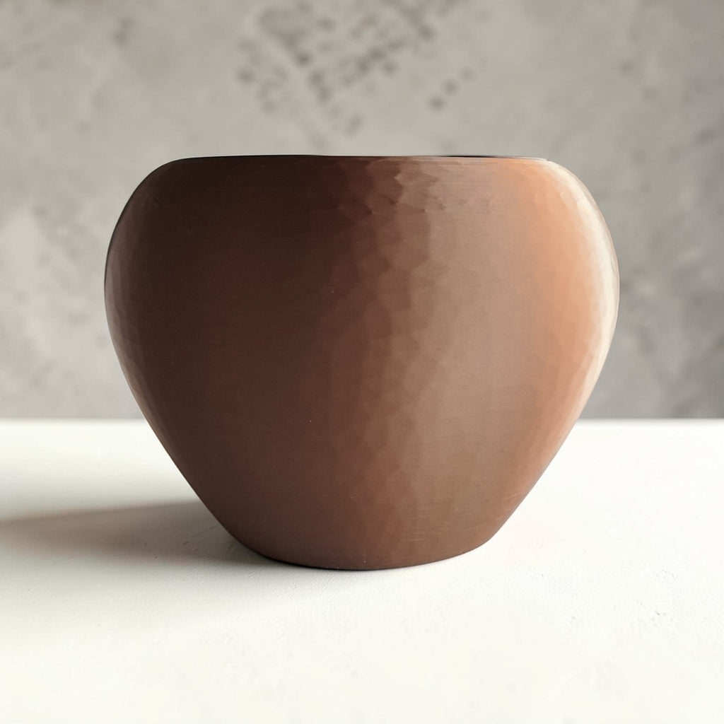 Self-watering plant pot in a hammered design
