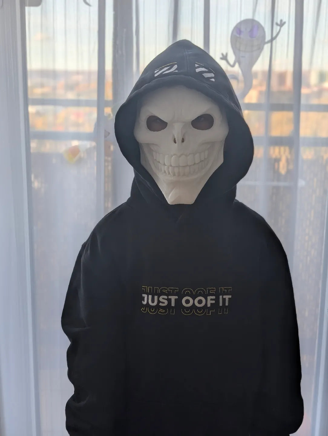 Yellow Skinwalker masks worn with purple hoodies