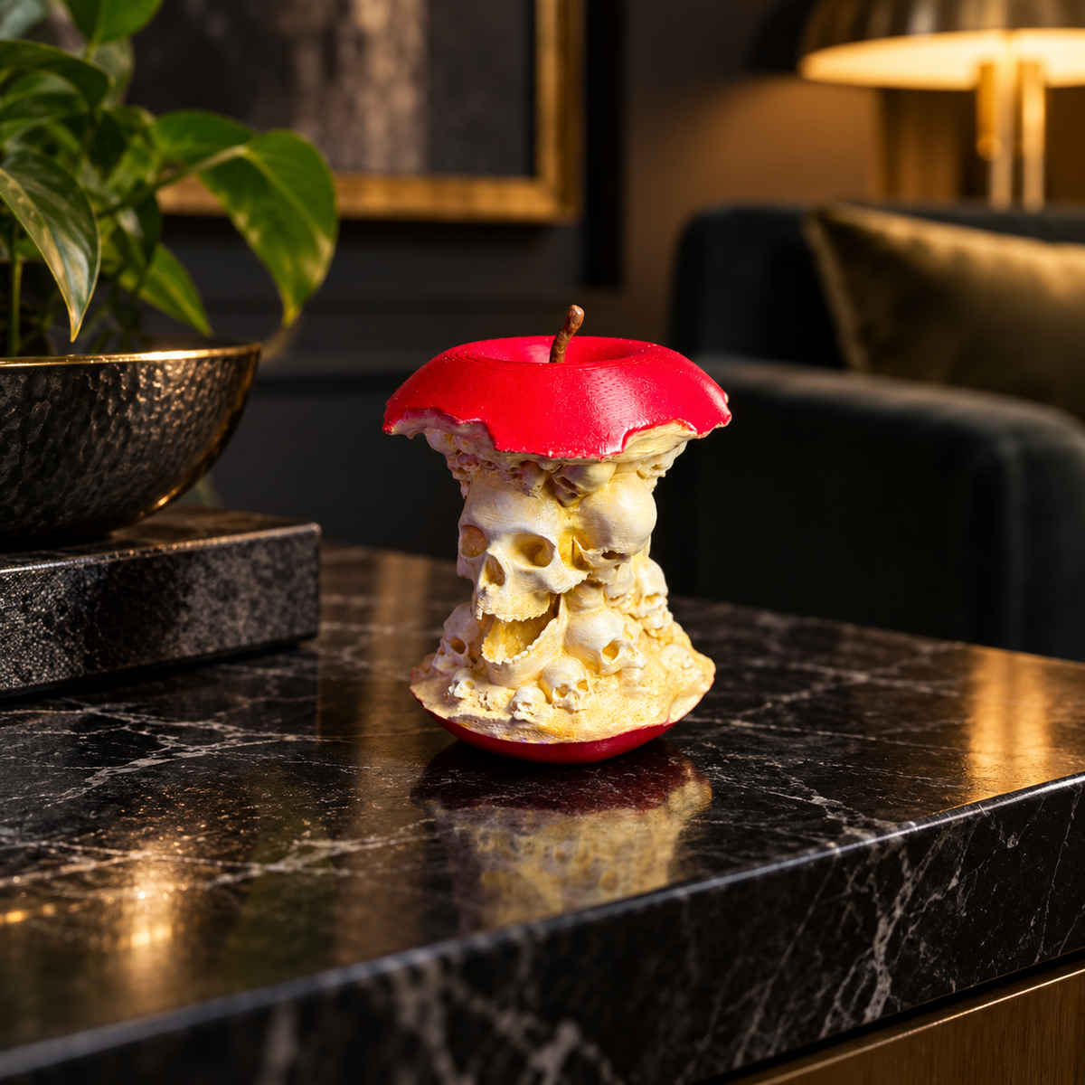 Forbidden Fruit skull apple sculpture styled with pumpkins and Halloween decorations