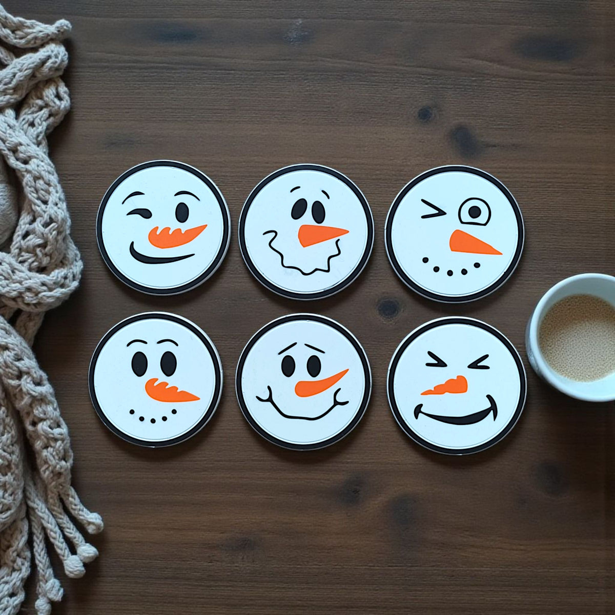 Six different snowman coasters displayed together