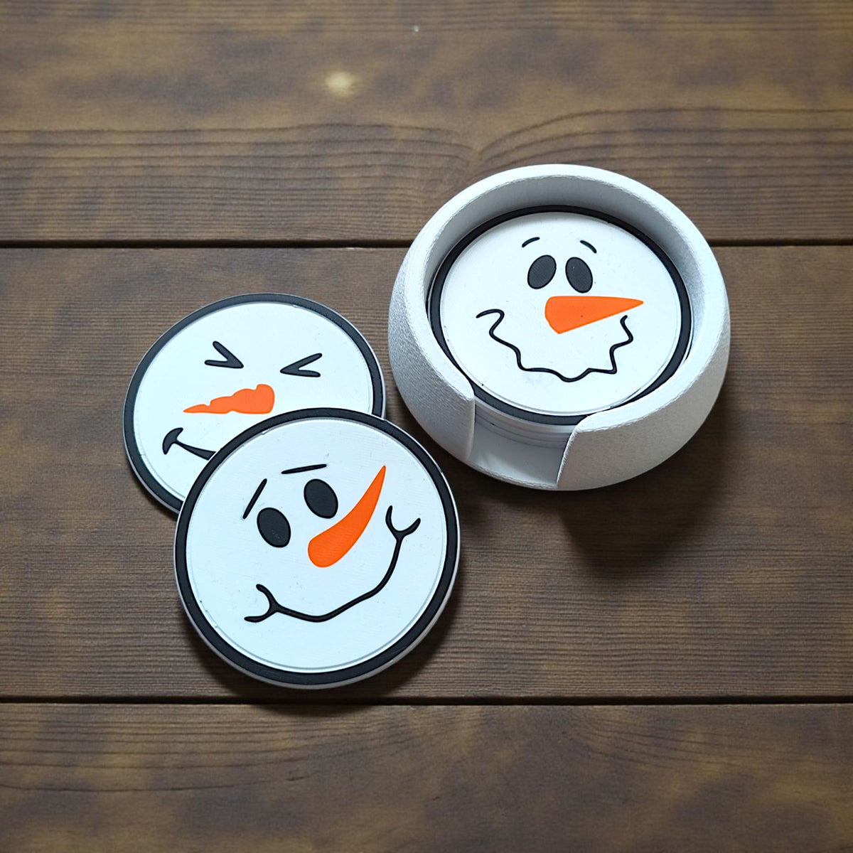 Snowman coasters and textured holder on winter table