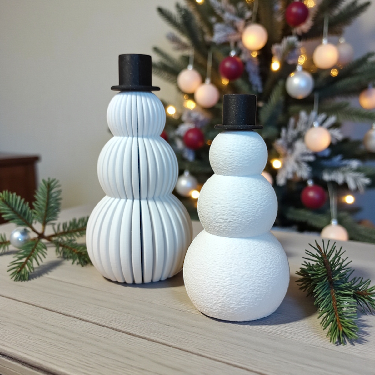 Snowmen set on white windowsill with Christmas greenery and pine cones