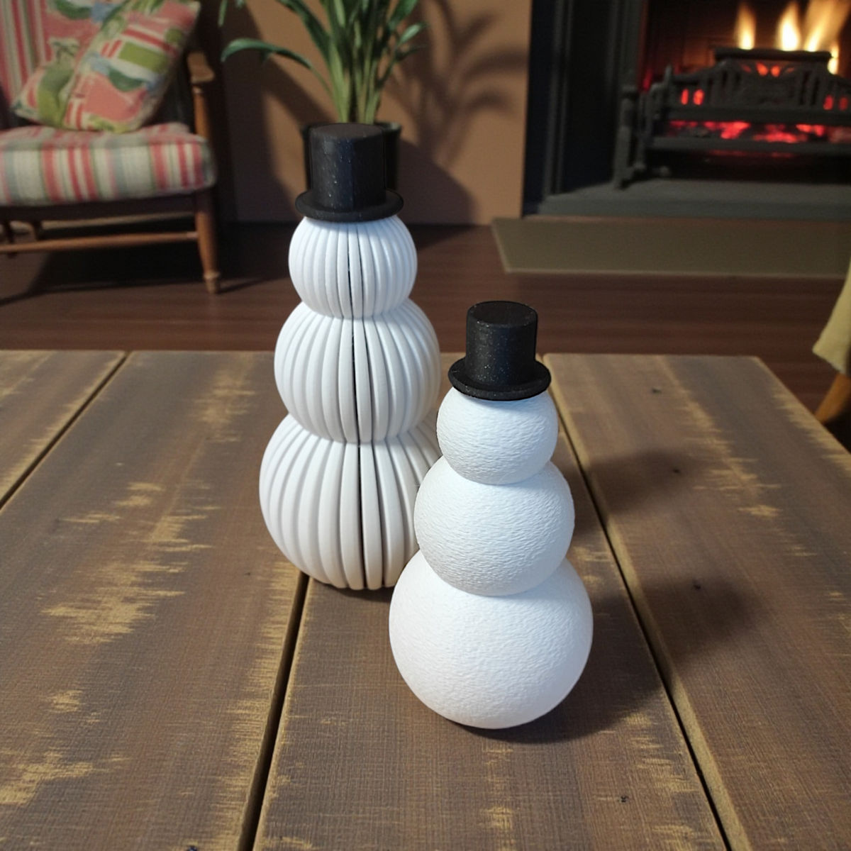Snowmen set styled with Christmas baubles and gold branches on dark background