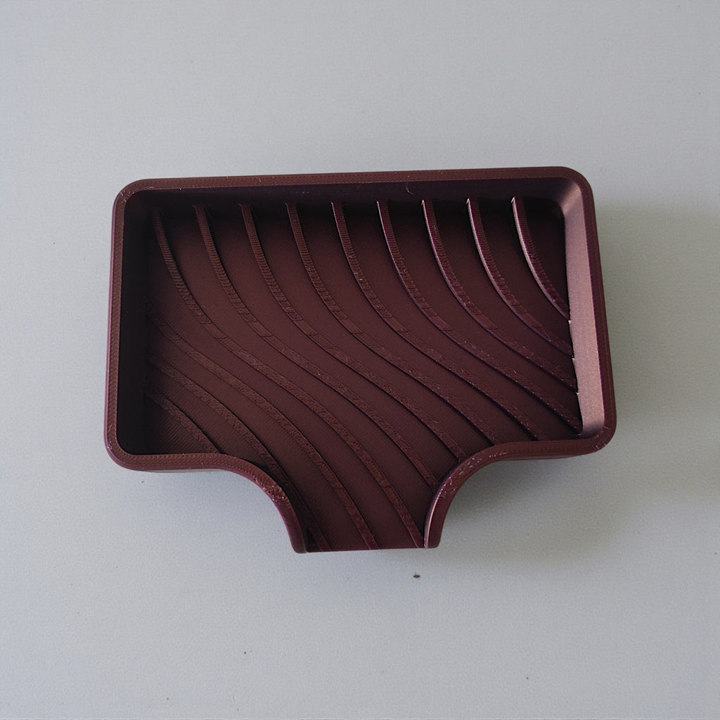 Curved soap dish with drain