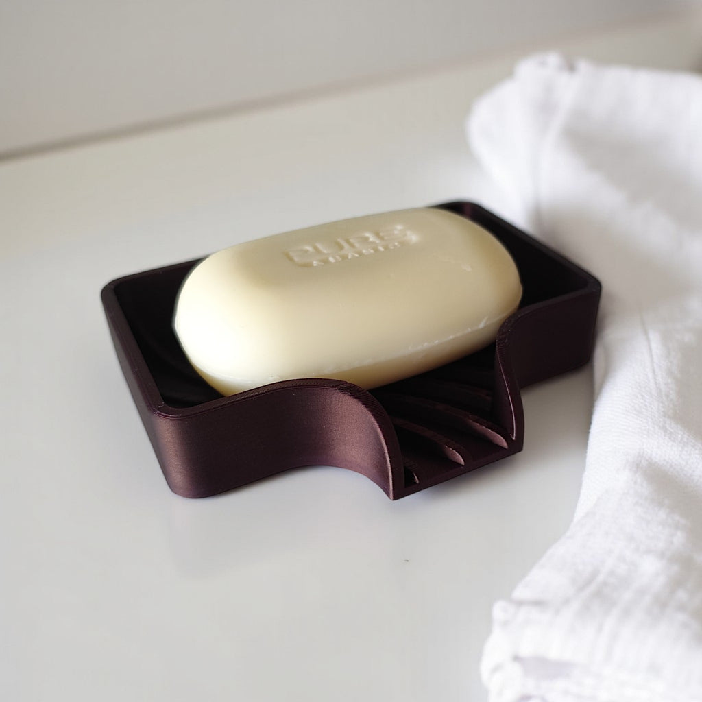 Curved soap dish with drain