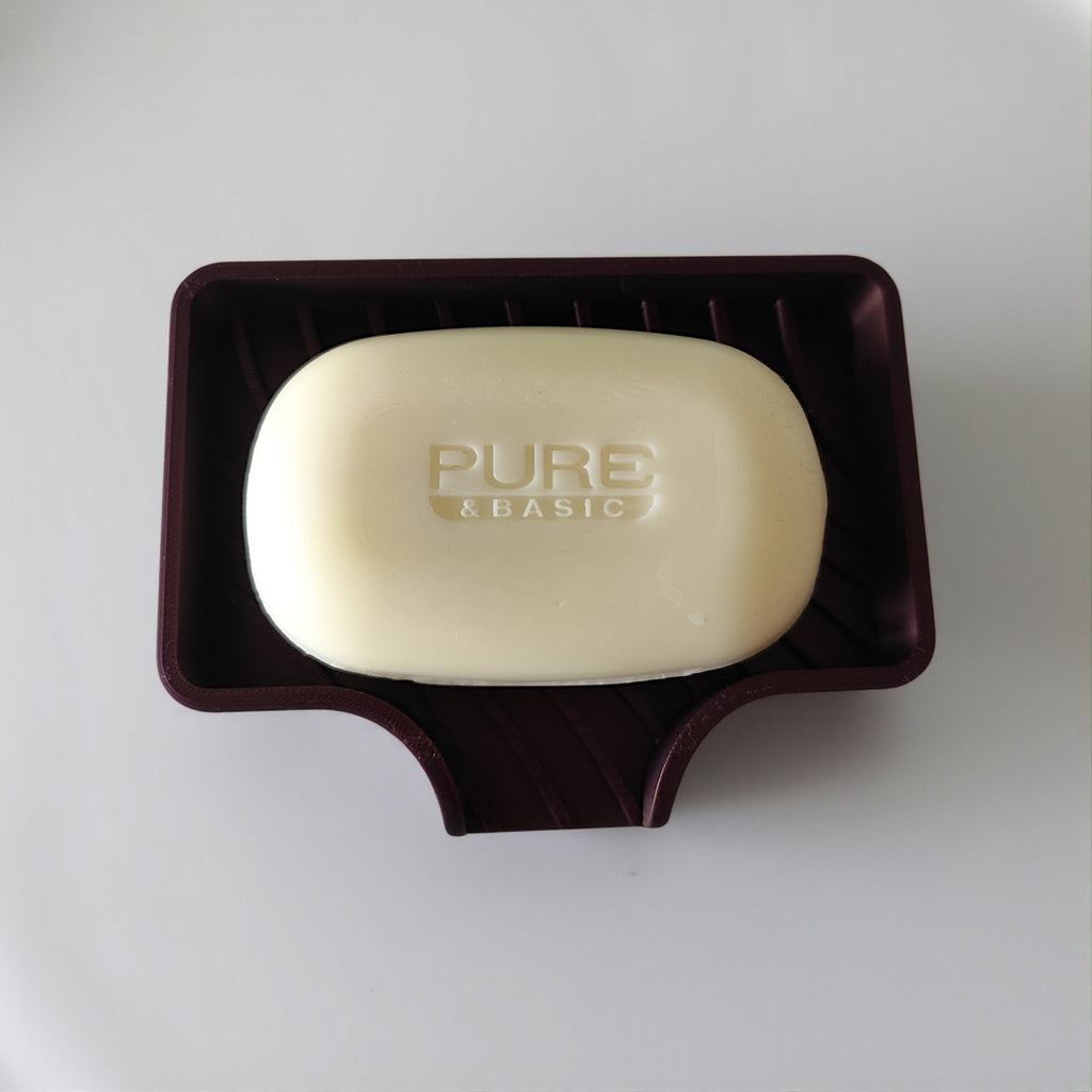 Curved soap dish with drain