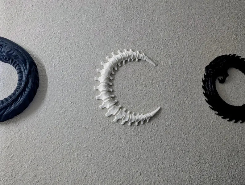 White Spinal Moon against dark background