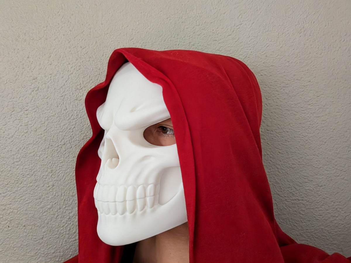 Grinning Skull Mask pictured with a demonstration elastic strap; the strap is not included.