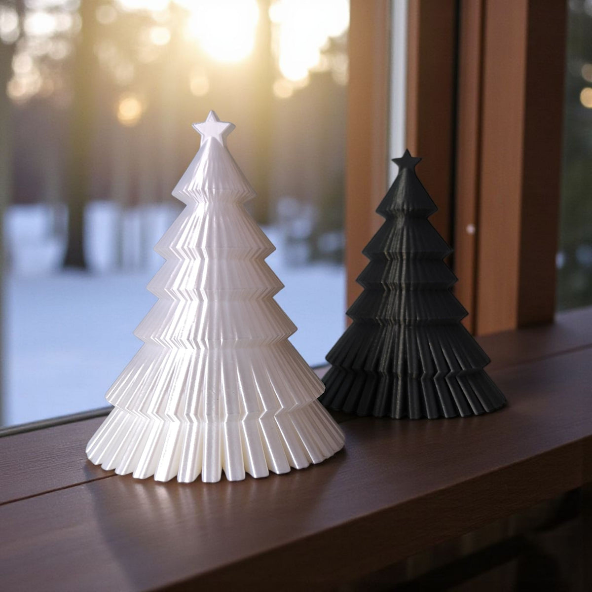 Dark grey ribbed Christmas tree with gold baubles and festive greenery flat lay
