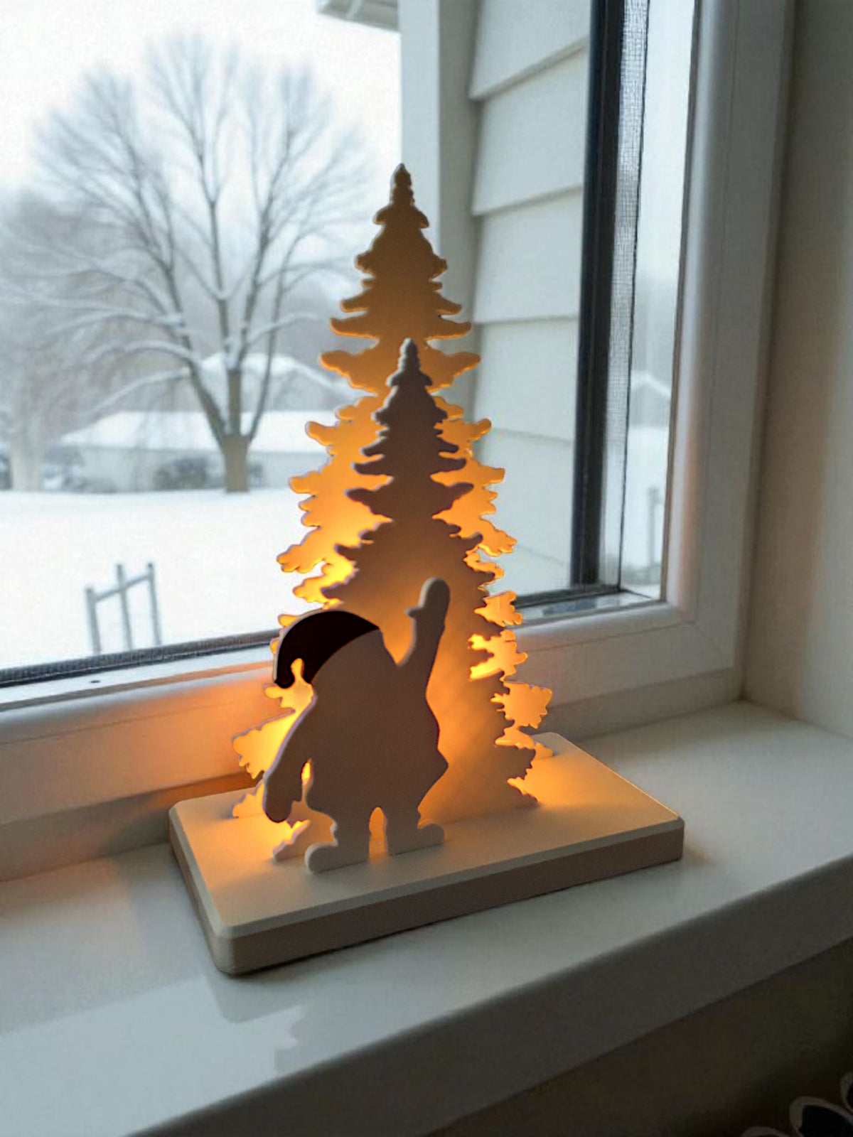 Santa Claus tree scene glowing amber on wooden table with misty pine forest outside window