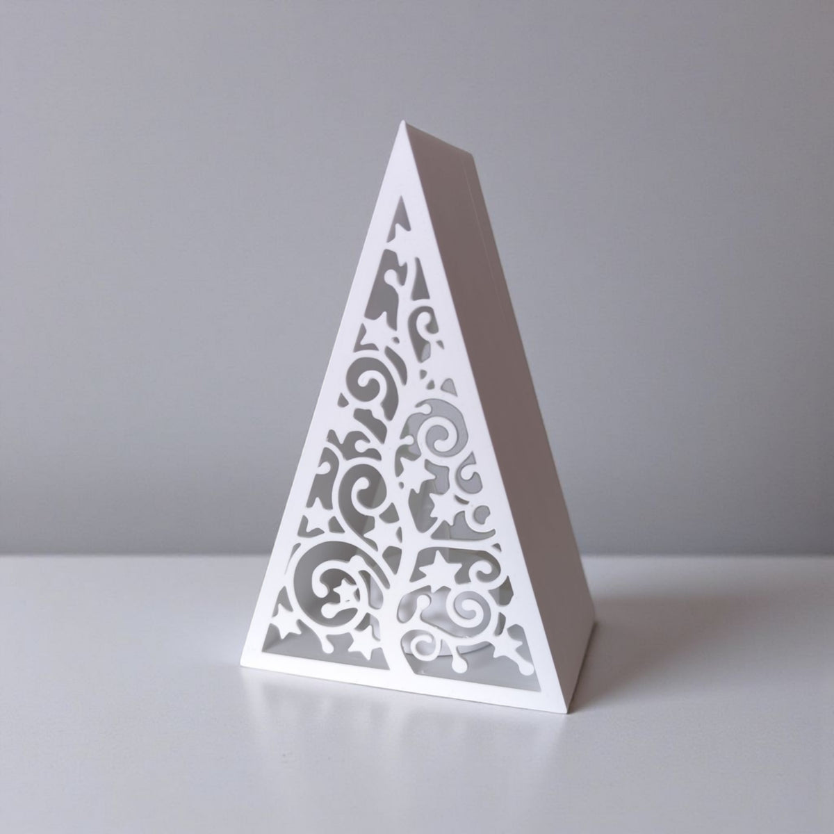 White pyramid Christmas lantern clean product shot on grey background