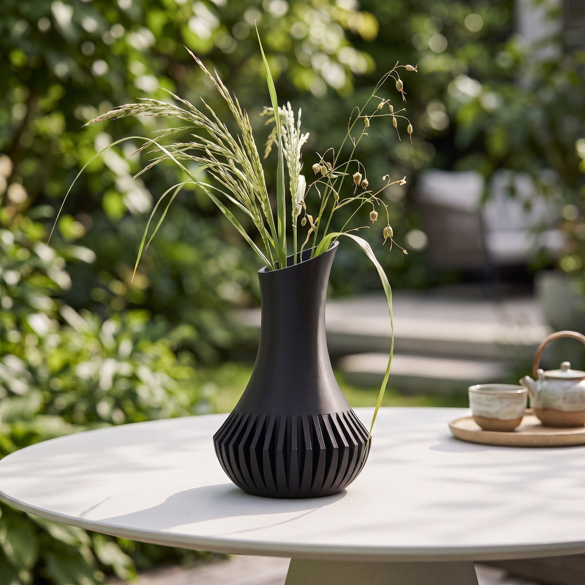 Veluna vase with dark red roses and eucalyptus in minimalist living room