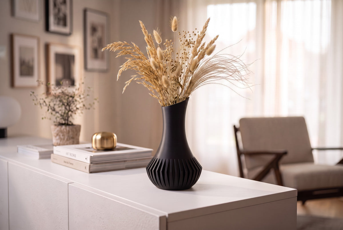 Veluna vase with wild grasses on outdoor marble table
