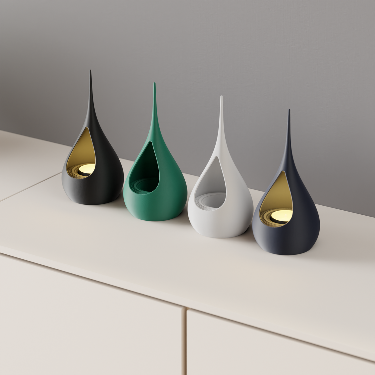 Teardrop LED Tealight Holder four holders black forest green white navy close up teardrop aperture warm gold LED glow cream sideboard grey wall