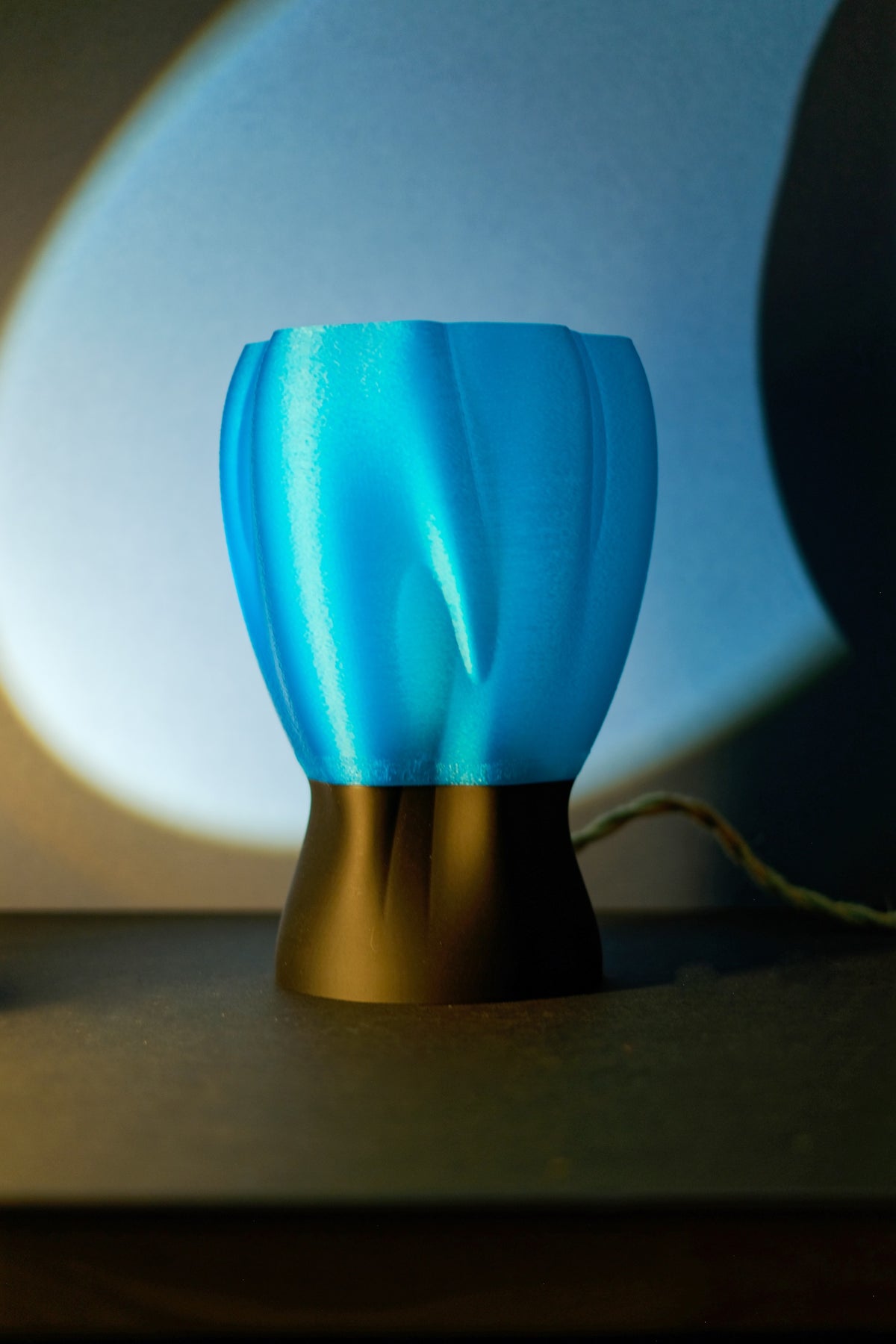 Draped organic flow lamp close up macro detail of translucent draped surface texture