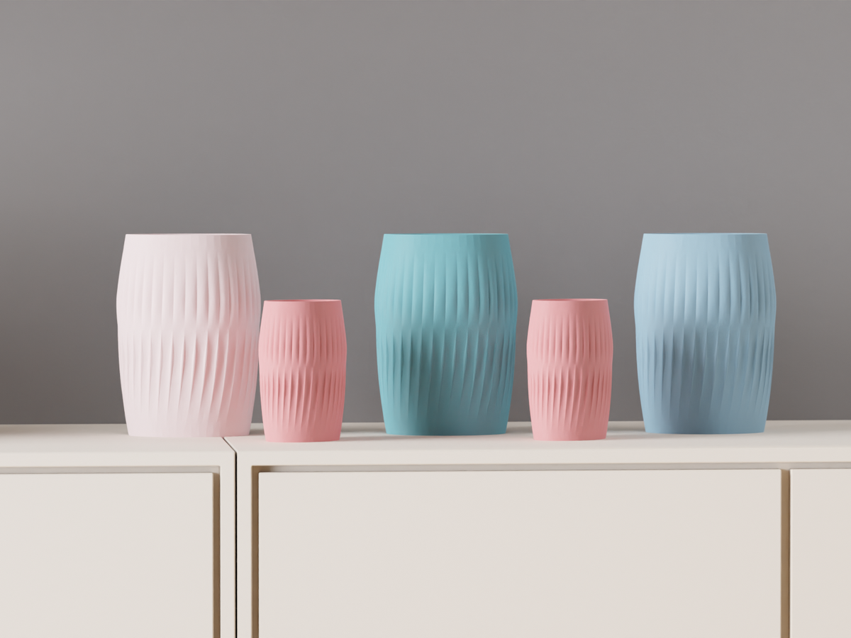 Rippled Barrel Vases in white, pink and blue displayed on a modern sideboard