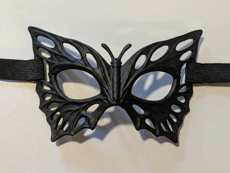 Butterfly Mask product photo showing its butterfly silhouette and cutout wing pattern.
