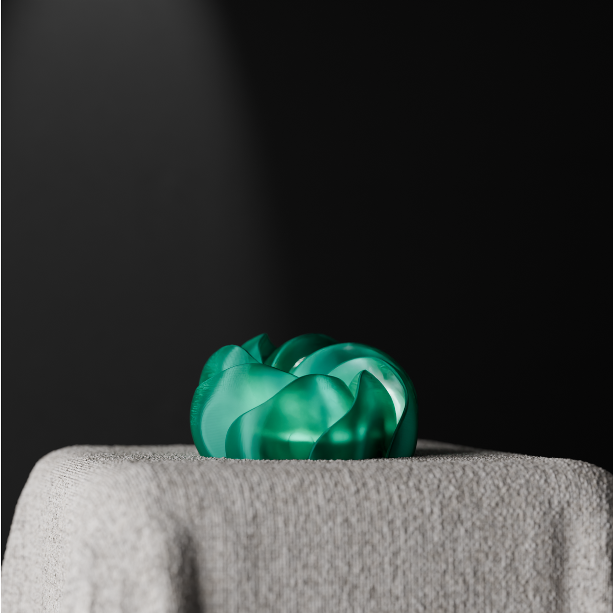 Cloud Twist Lamp low wide circular bloom smooth flowing twisted ribbon petal structure emerald green teal pale grey linen plinth dark studio background dramatic light petal twist sculptural hero shot