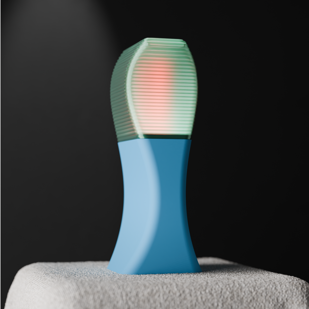 Elegant Sweeping Curve Lamp teal shade blue base glowing atmospheric on draped table dark background editorial