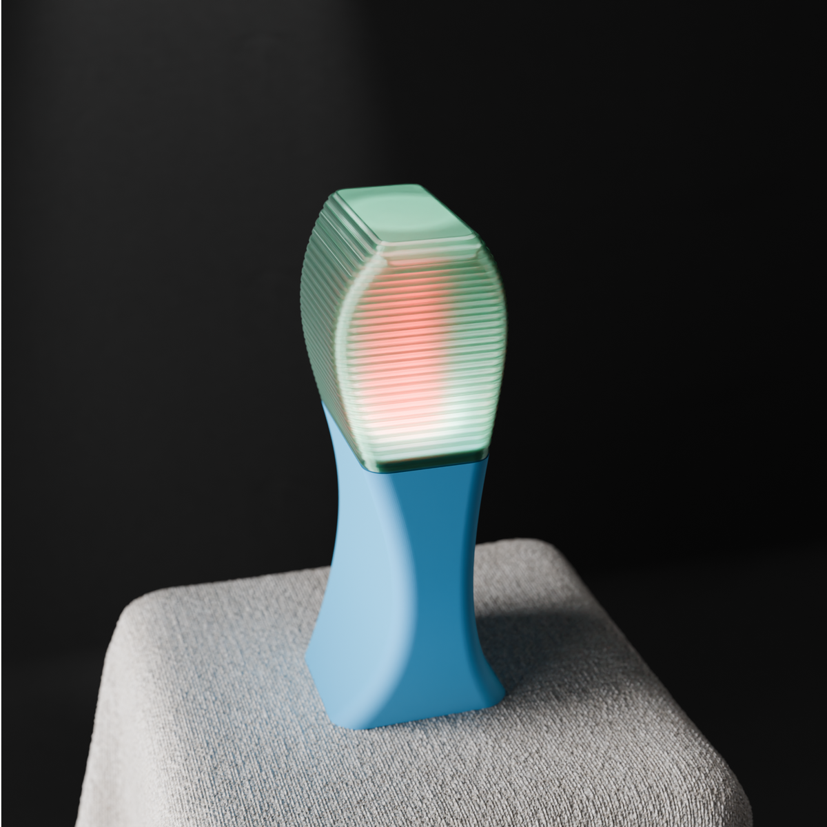 Elegant Sweeping Curve Lamp teal shade blue base glowing on draped table side view dark background